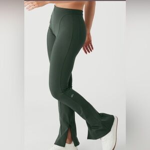 Alo Yoga High-Waist Zip it Flare Legging in Dark Cactus Green.